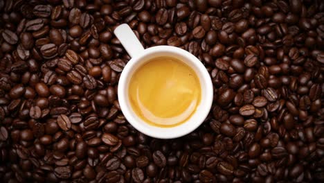 espresso shot with coffee beans background (looping)