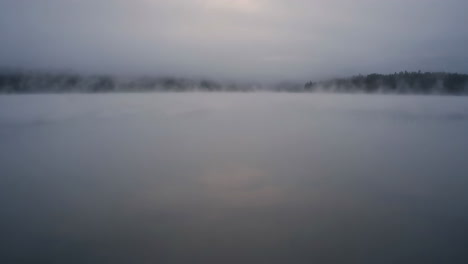 misty morning over a lake