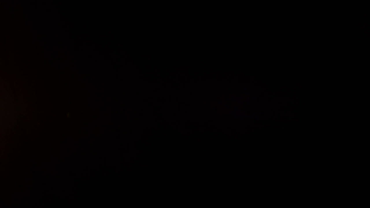 Animation of burning antique document, over white powder falling on black background