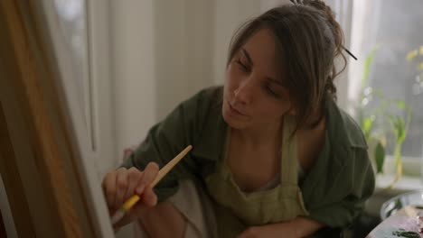 woman painting at home