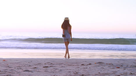 Woman-walking-with-camera-in-the-beach-4k