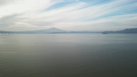 Soothing pullback over calm serene waters near Richmond Bridge from Point Molate Beach Richmond California USA