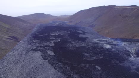 the lava field of fagradalsfjall volcano, geldingadalir valley, iceland - aerial drone shot