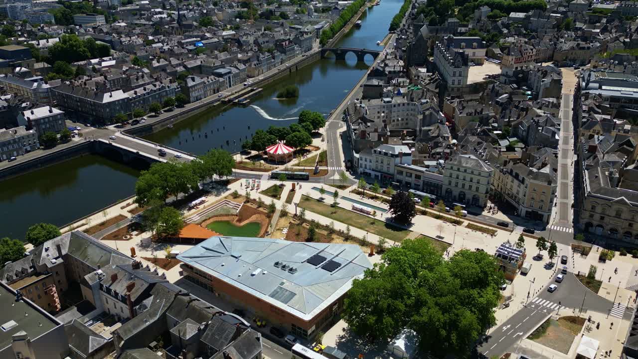 Backward drone movement from the New Place from November 11th with St. Louis market halls of Laval Castle in background, Laval, Mayenne, France.