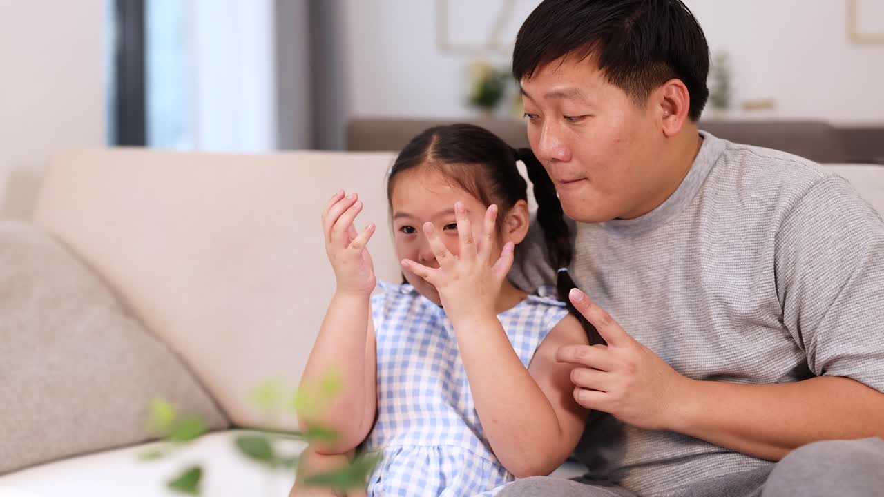 Father comforting upset daughter