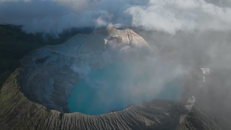 breathtaking view of ijen volcano with magical blue sulfur lake in crater, east java