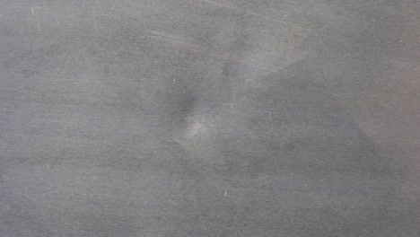 white liquid spill on a grey surface