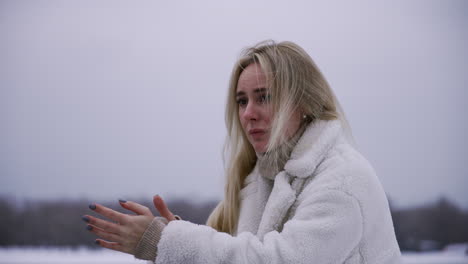 worried woman standing outdoors