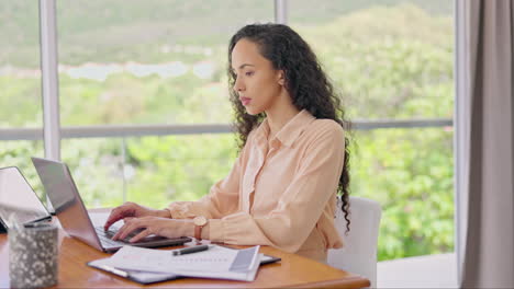 Woman,-working-and-typing-on-laptop-in-home-office