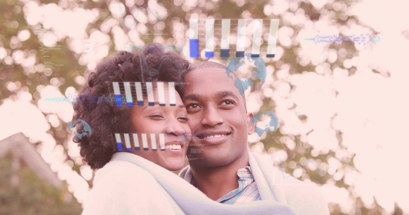 Couple wrapped in blanket, as frames rolling data charts animating, brightening smiles for tech