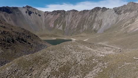 glacial lake inside volcano crater nevado de toluca in central mexico. aerial drone shot