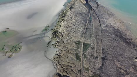 view over the sandy and rocky beach near fort de la crèche