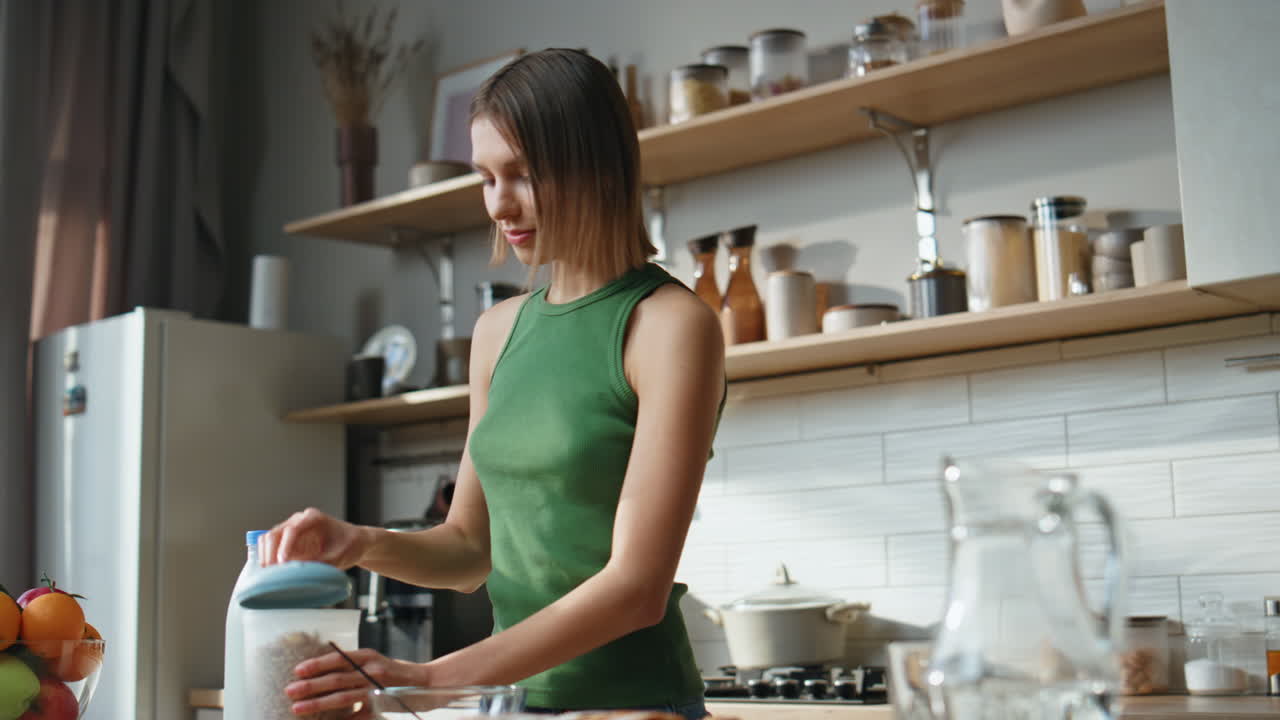 Woman preparing breakfast in the kitchen