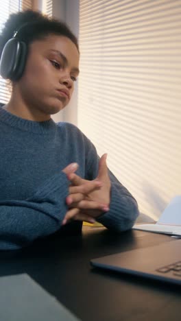 young woman working on a laptop