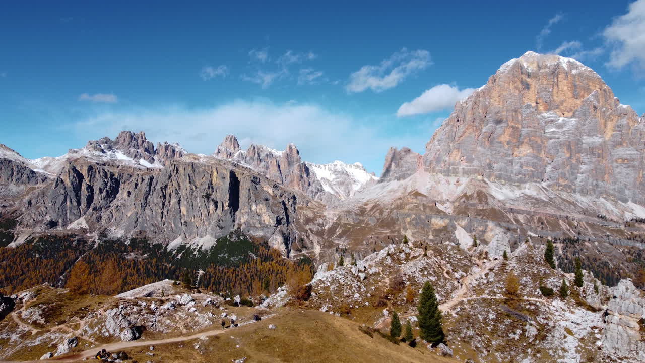 Aerial view of the Dolomites. Tofane, Lagazuoi. Hike near the Giau Pass, Cinque Torri, Cortina. Mountains in autumn with the first snow on the peaks