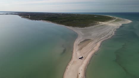 Skagen-Grenen-Aerial-To-Peninsula-with-Tourists,-Denmark