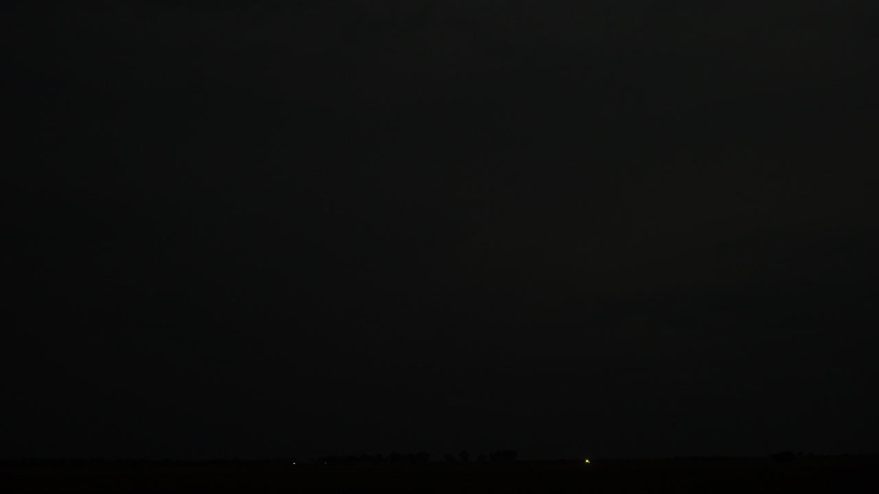 Dark sky and flashing lightning during South East Asia monsoon season