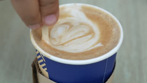 hand stirring latte art