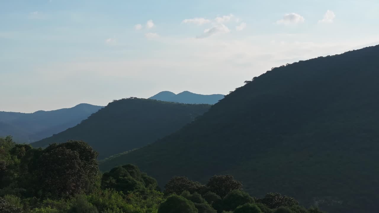telephoto aerial trucking pan along compressed mountainous region views at midday (텔레포토 항공 트럭  ⁇ )