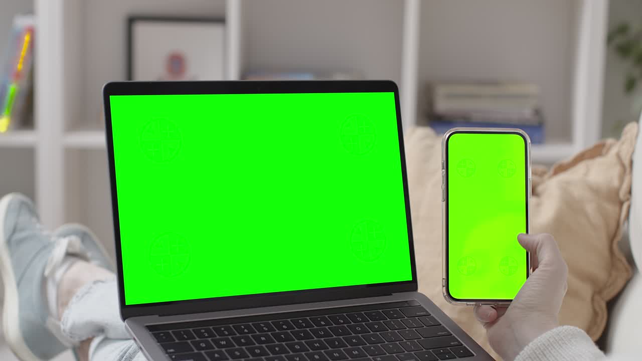 Woman Lying on Sofa with Laptop
