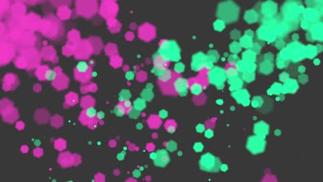 volar verde y rosa bokeh con partículas en el fondo brillante