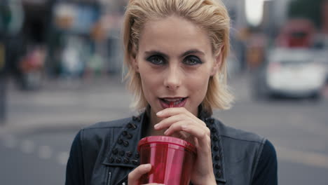 Slow-Motion-Portrait-of-happy-beautiful-caucasian-punk-woman-drinking-juice