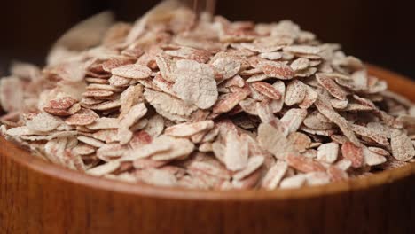 crispy rice flakes in wooden bowl