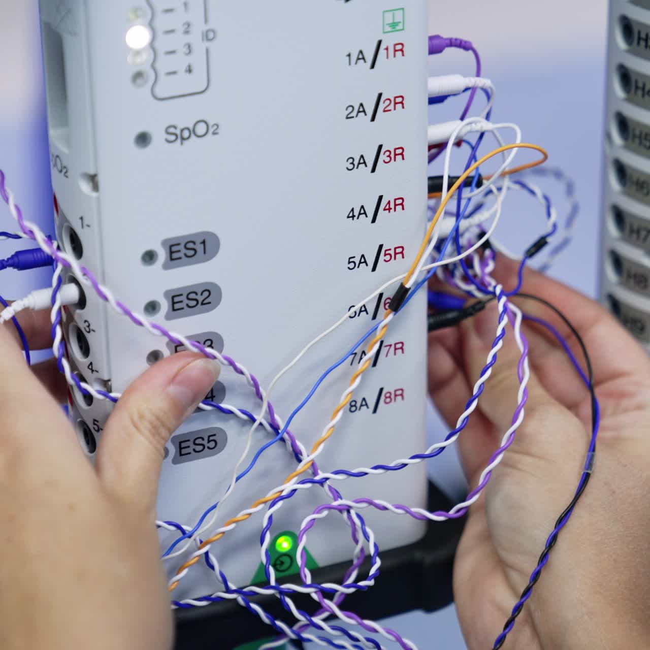 Modern advanced device for neuromonitoring in clinics. Preparation for the procedure connecting wires. Close up
