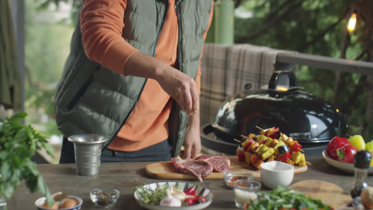 Food Blogger Salting Steaks and Talking on Camera