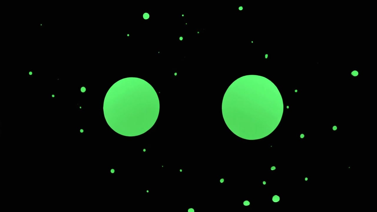 Schizzo di liquido verde che si trasforma in due cerchi perfetti