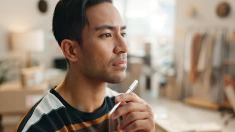 creative asian man, face and thinking with pen