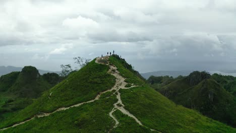 amazing green lugsangan peak between an hilly landscape on a cloudy day in the badian heights in the province cebu in the philippines