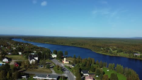 aerial drone shot over town near river in iceland