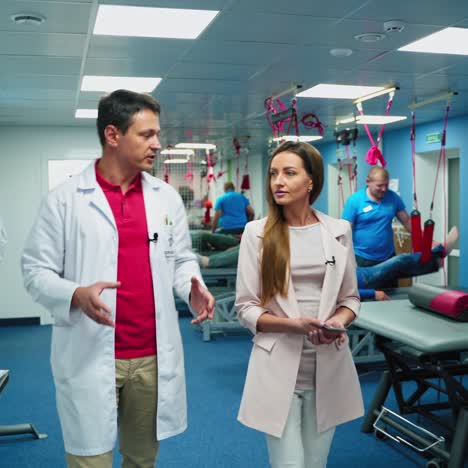 doctor advice concept. young physician in white coat consults woman in medical office. specialist gives medical healthcare recommendations. rehabilitation center.
