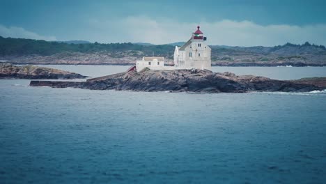 groningen lighthouse stands on the rocky island near the kristiansand coast