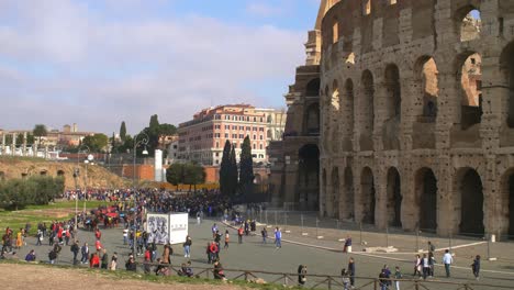 tourists outside colosseum