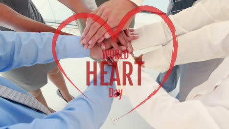 animation of world heart day text over group of business people