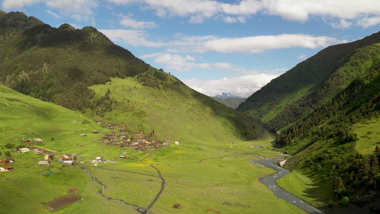 Wide rotating drone shot Dartlo village in Tusheti Georgia with medieval combat towers