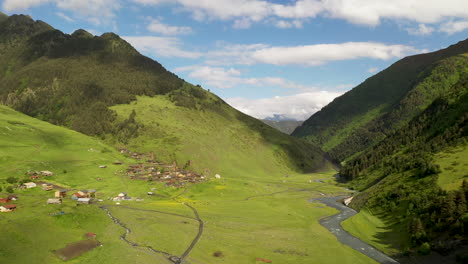 wide rotating drone shot dartlo village in tusheti georgia with medieval combat towers