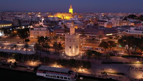 Vista-Orbital-Nocturna-De-La-Torre-Del-Oro-O-La-Torre-De-Vigilancia-De-La-Torre-Dorada-En-Sevilla-España