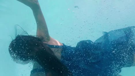 Beautiful-woman-swimming-underwater