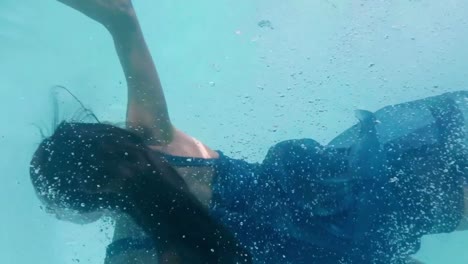 beautiful woman swimming underwater