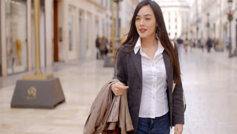 stylish woman in an urban pedestrian mall