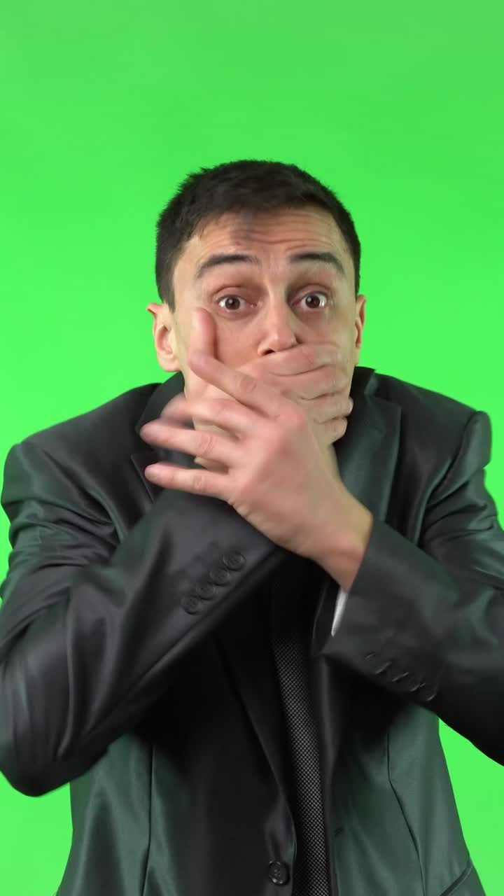 Businessman showing various emotions on a green screen