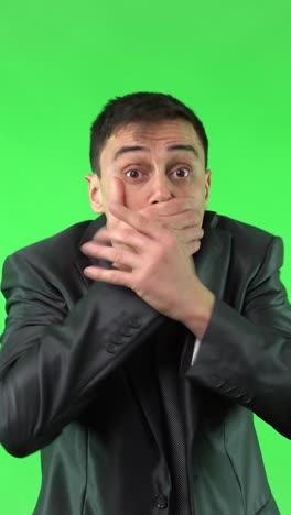 businessman showing various emotions on a green screen