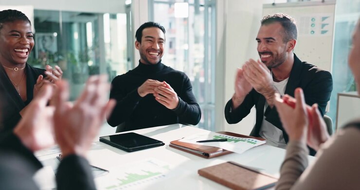Diverse Business Team Celebrating Success with Applause in Office Meeting