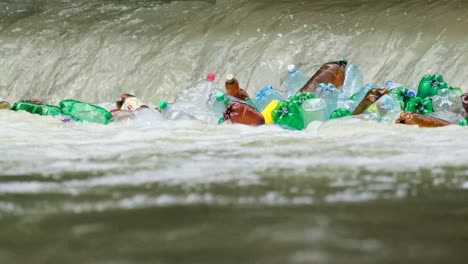 ranger Pick up Water into the Plastic Bottle from the River at the Jungle Closeup Ranger Pick up Water into the Plastic Bottle from the River at the Jungle Closeup