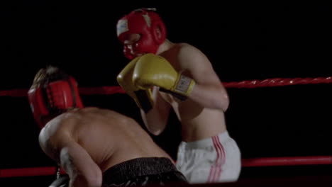 two boxers fight in a boxing ring