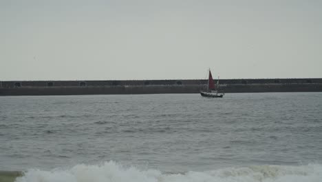 sailing a yacht out the river mouth into the open ocean