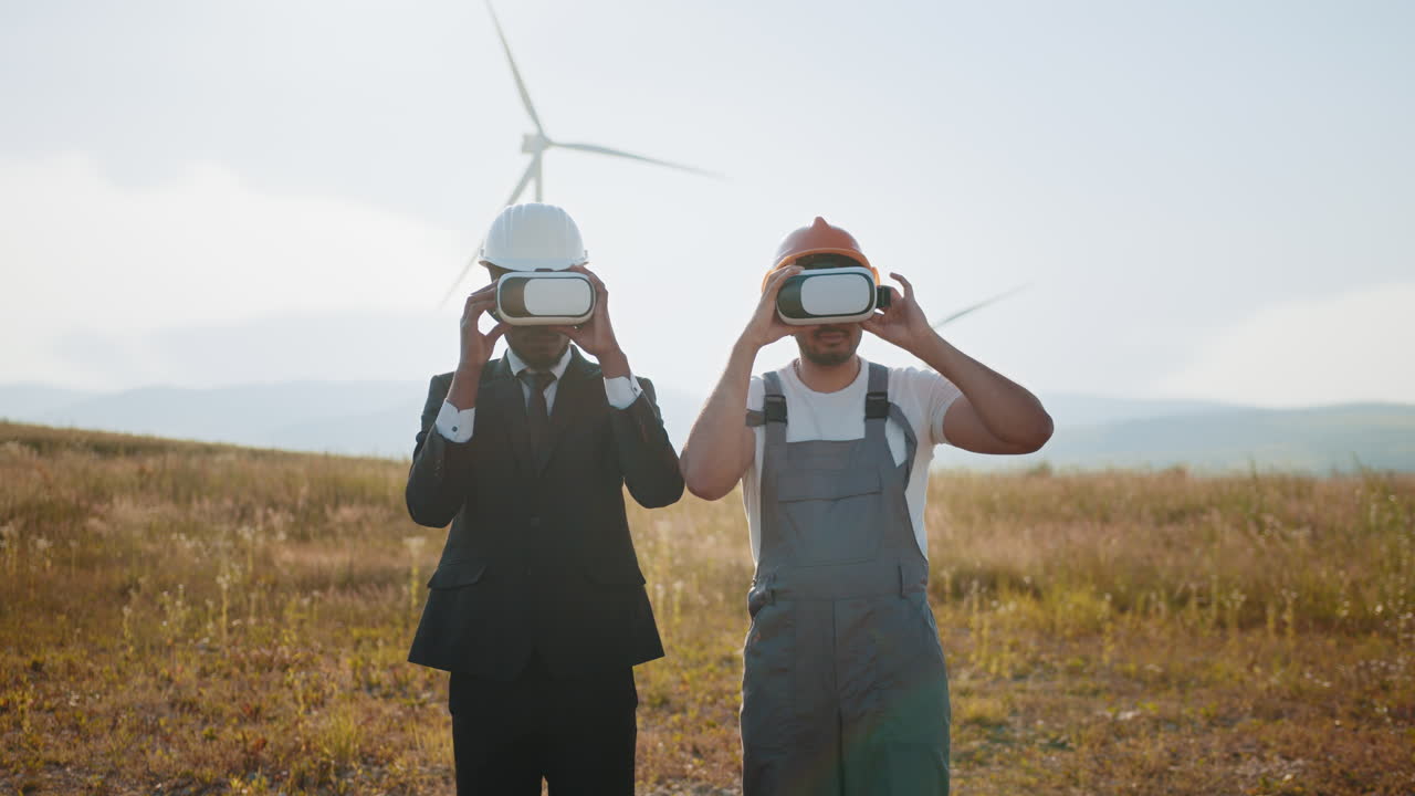 Businessmen and construction workers using VR in a wind farm